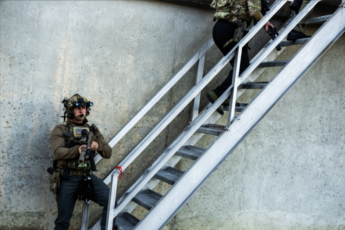Officer clearing a tight interior space with an INFORCE weapon light