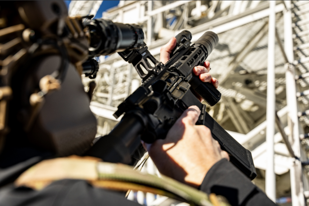 Officer observing a subject at distance using controlled illumination
